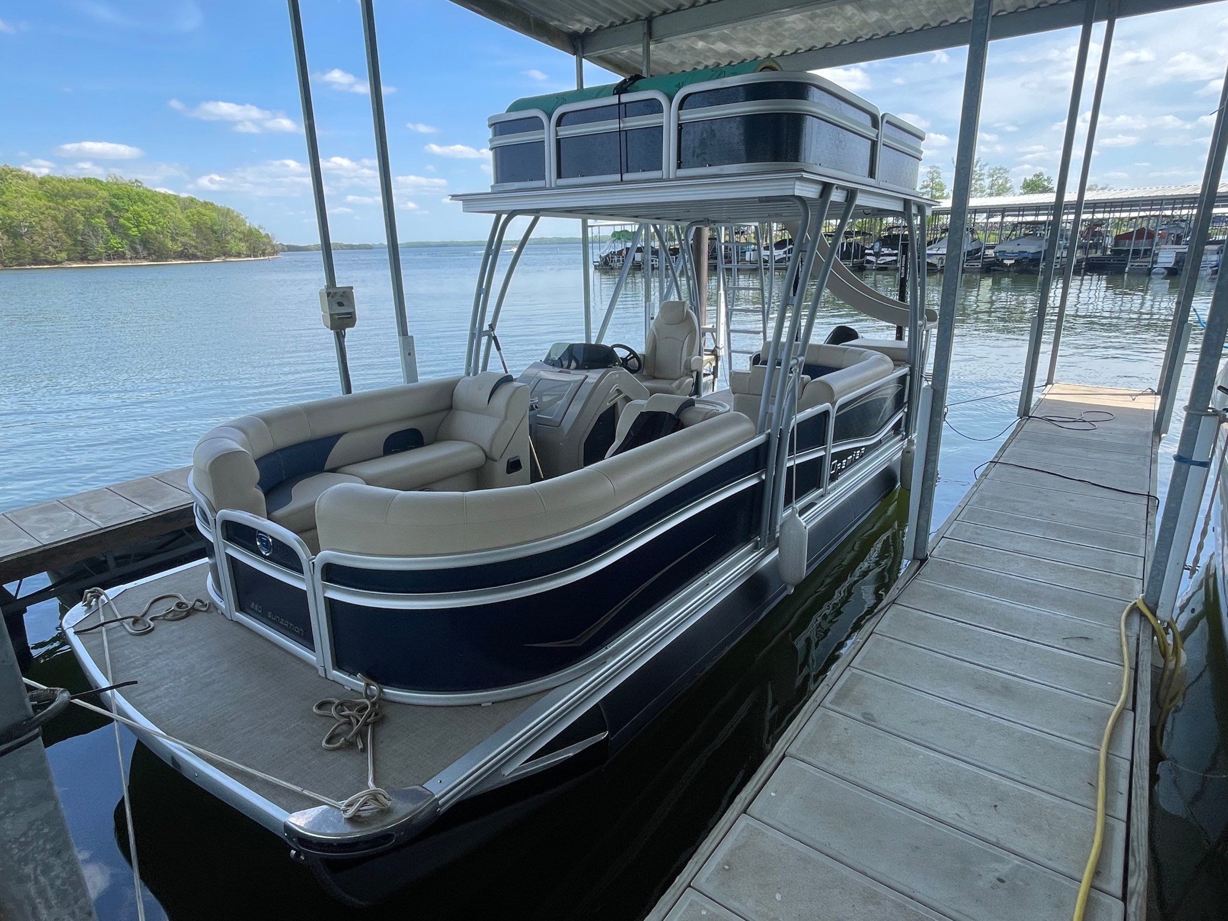 a boat is docked next to a body of water