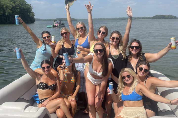 a group of people on a boat posing for the camera